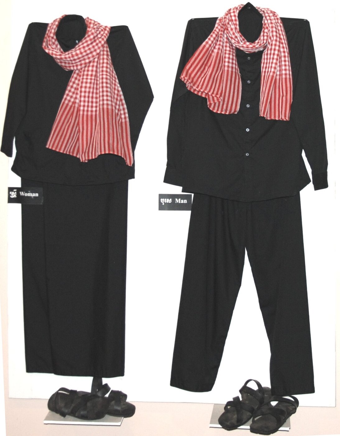 Black garments and a checked scarf in a Choeung Ek museum display