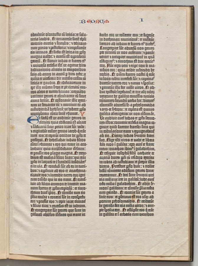 Two columns of blackletter Latin text with red and blue hand-painted initials.