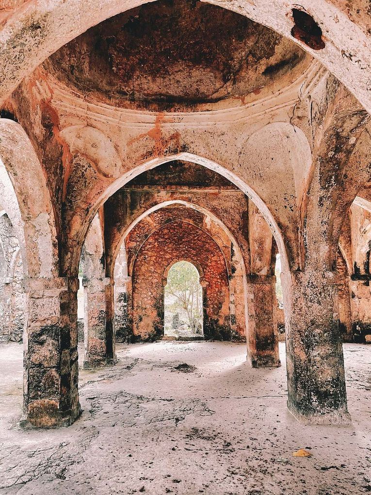 The roofless stone arches and walls of the Great Mosque at Kilwa.