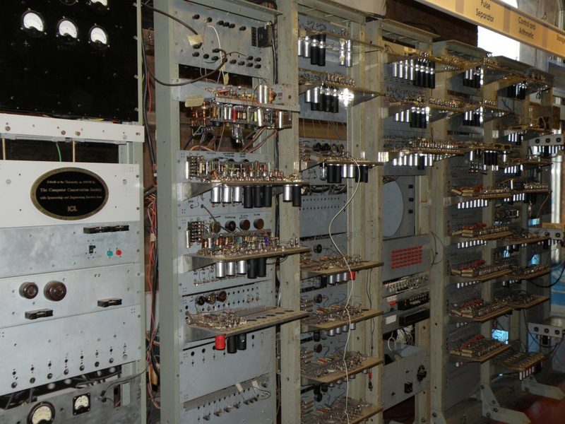 Baby reconstruction with racks of vacuum tubes, wiring and cathode-ray tubes