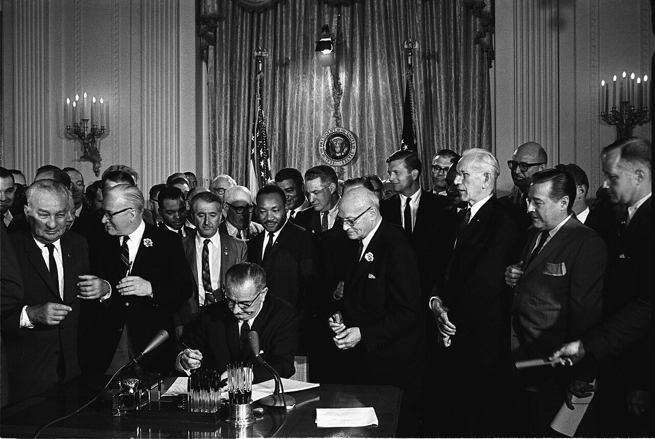 Signing the Civil Rights Act in 1964